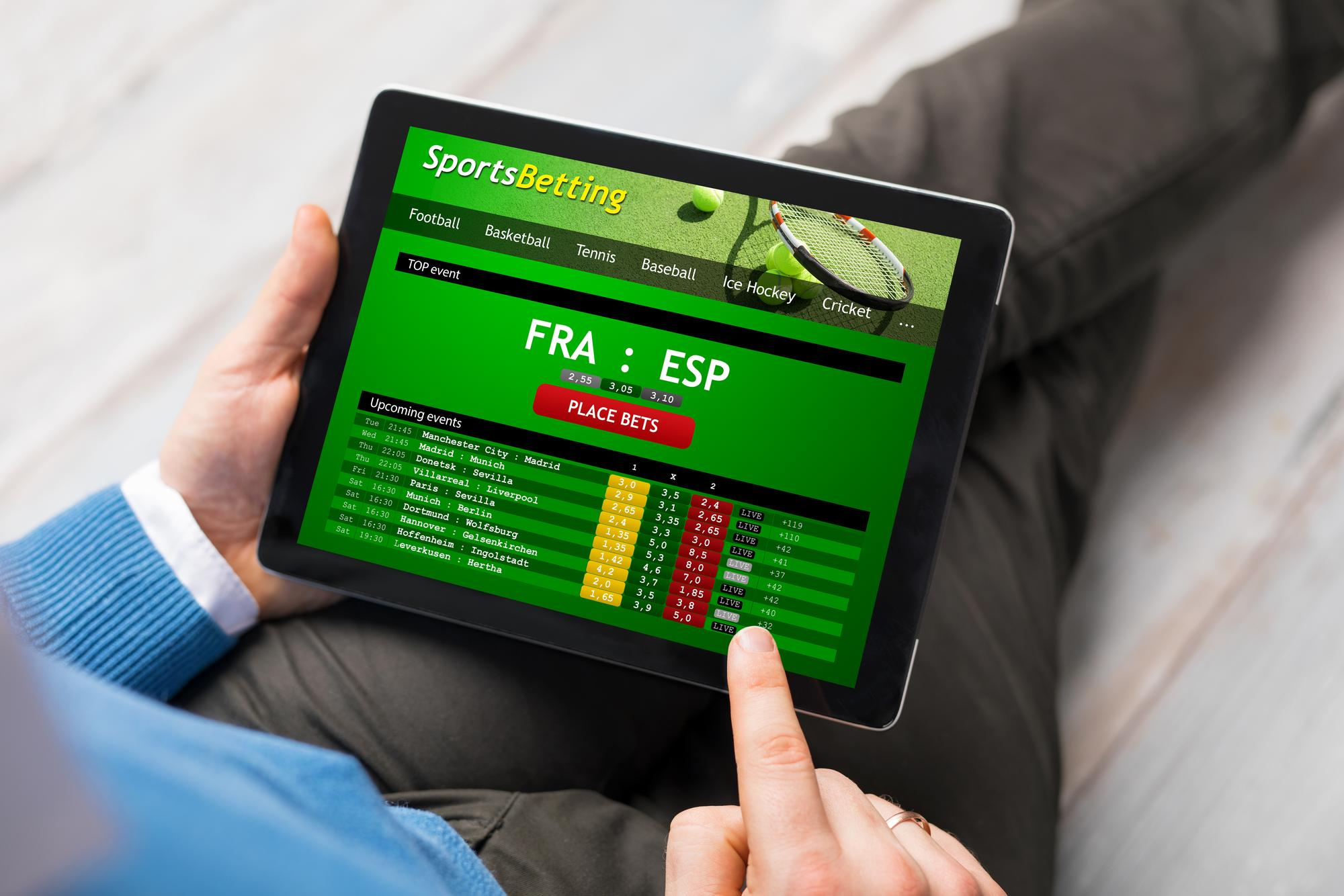 man using sports betting app